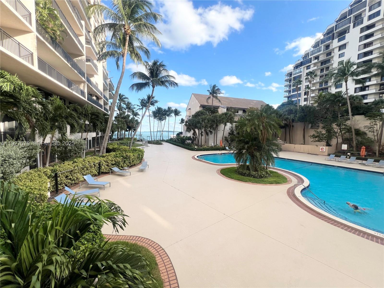 540 Brickell Key Drive, Unit 214 Miami, FL 33131 - Photo 44 of 48 a view of a park with palm trees