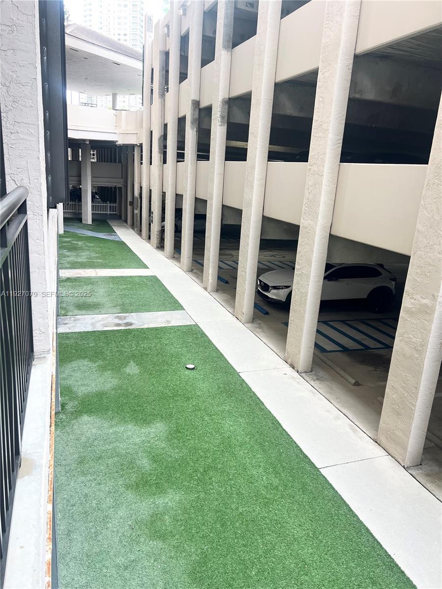 540 Brickell Key Drive, Unit 214 Miami, FL 33131 - Photo 7 of 48 a view of yard with staircase