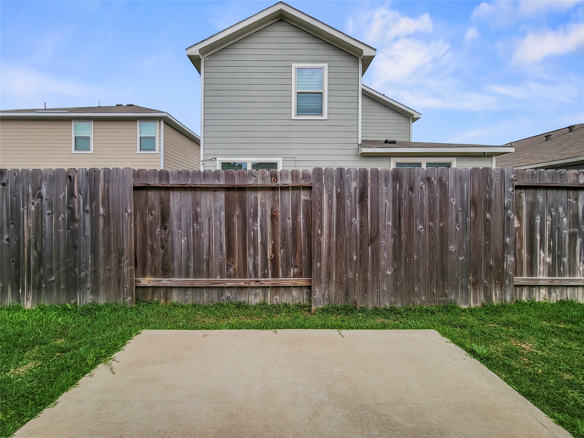 16983 Pandora Way Porter, TX 77365 - Photo 17 of 17 a backyard of a house with wooden fence