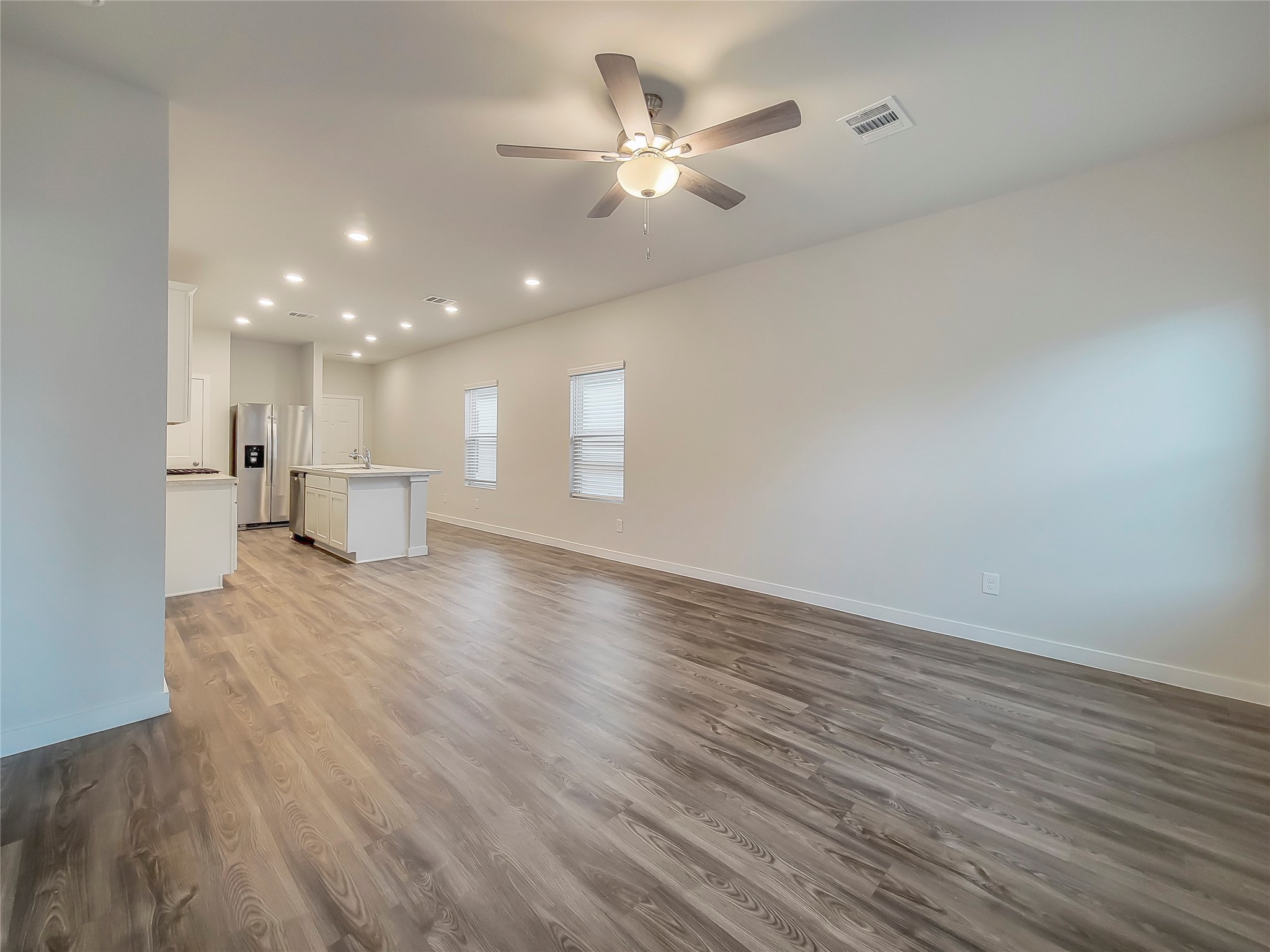 16983 Pandora Way Porter, TX 77365 - Photo 4 of 17 a view of an empty room with a window and wooden floor