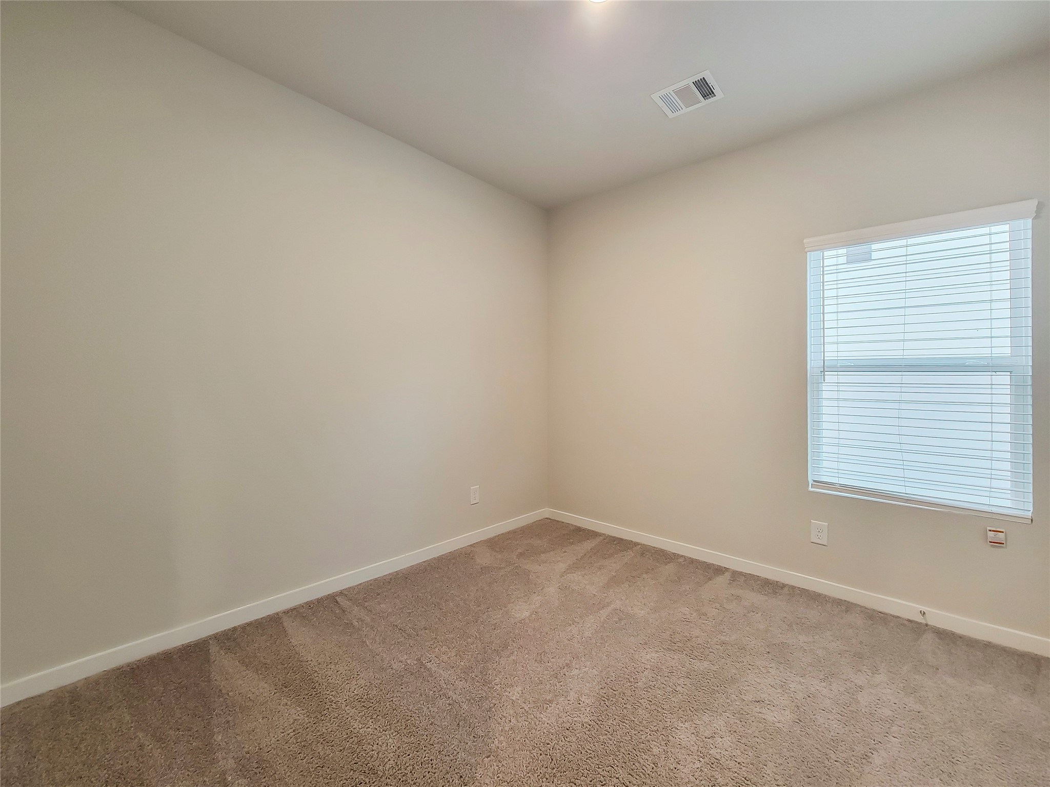 16983 Pandora Way Porter, TX 77365 - Photo 6 of 17 an empty room with a window