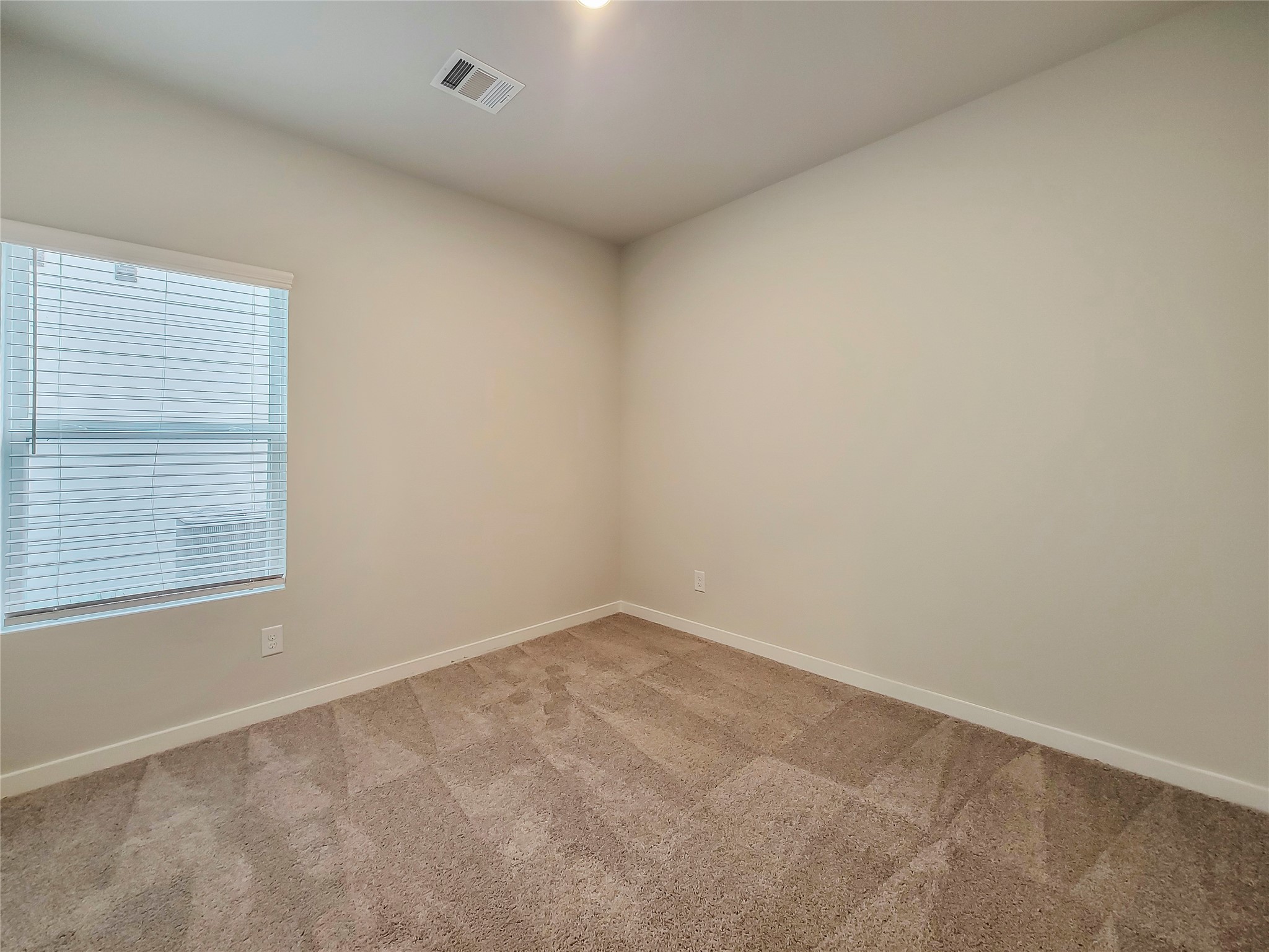 16983 Pandora Way Porter, TX 77365 - Photo 8 of 17 an empty room with a window