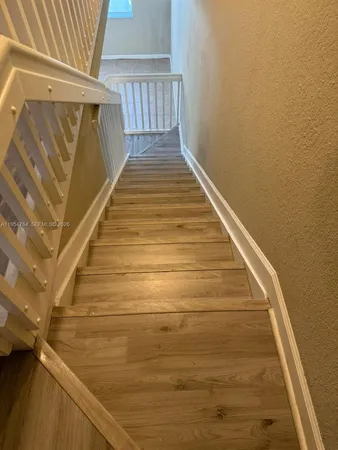 a view of a hallway with washer and dryer