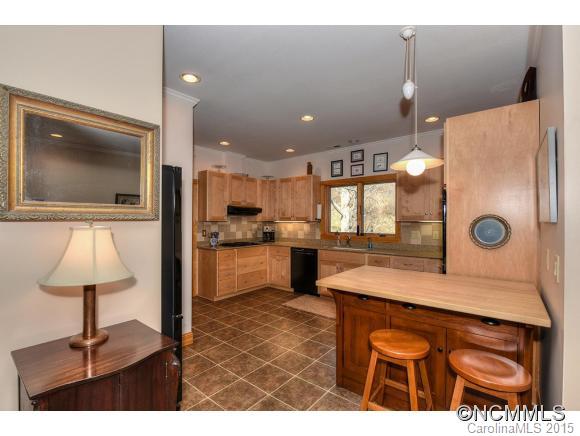 600 Fines Creek Road Clyde, NC 28721 - Photo 8 of 24 a kitchen with a sink and cabinets