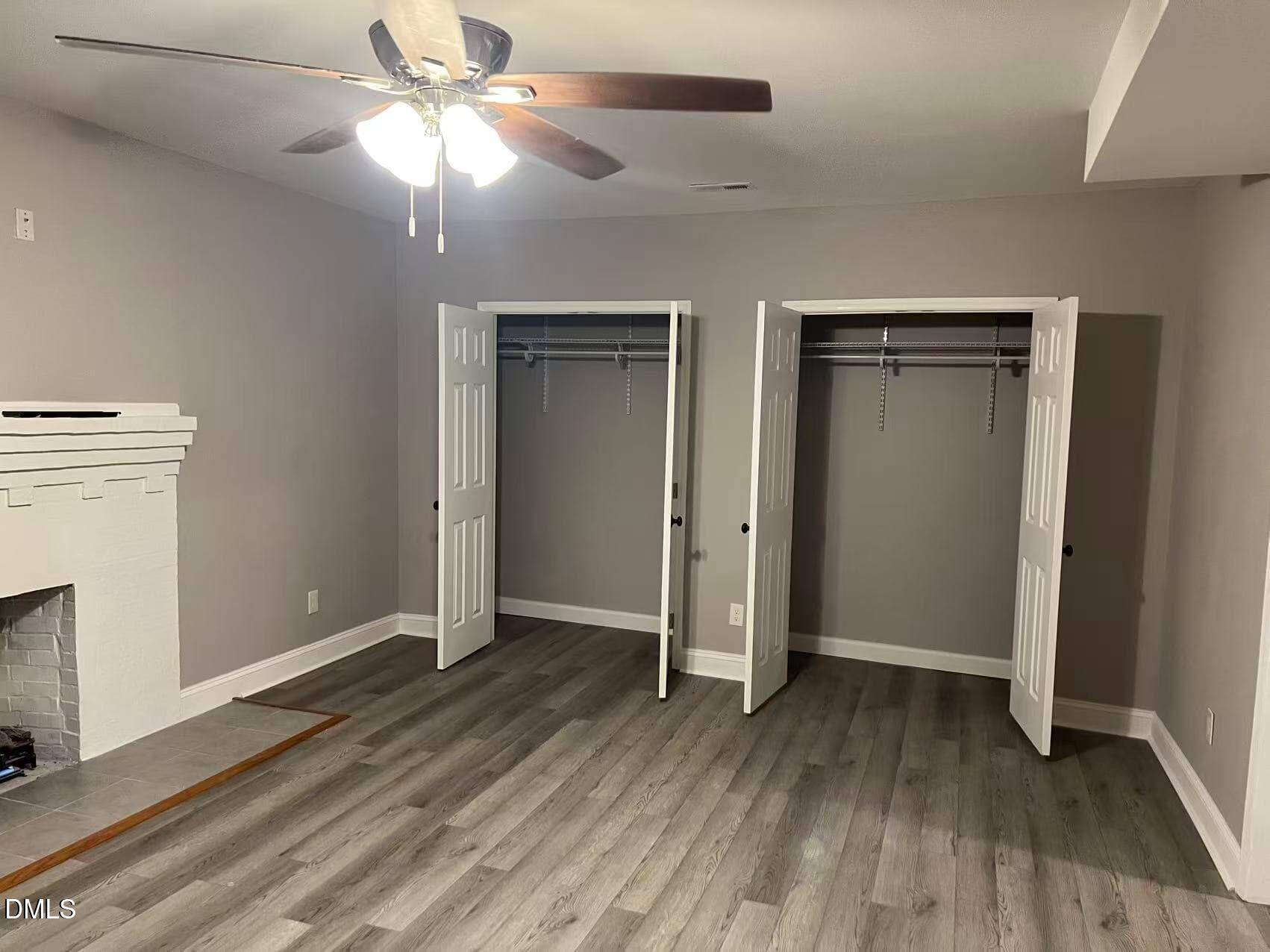 409 Rockingham Street Carthage, NC 28327 - Photo 16 of 56 an empty room with wooden floor a ceiling fan and closet