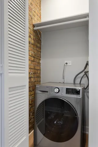 a utility room with washing machine