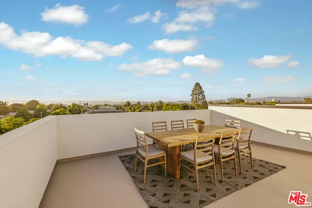 a view of a terrace with furniture