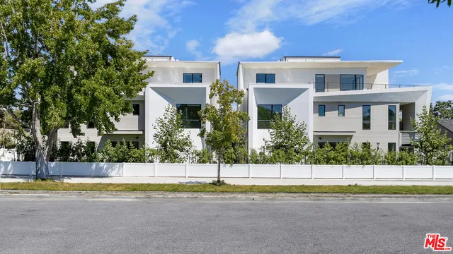 a view of house with a swimming pool