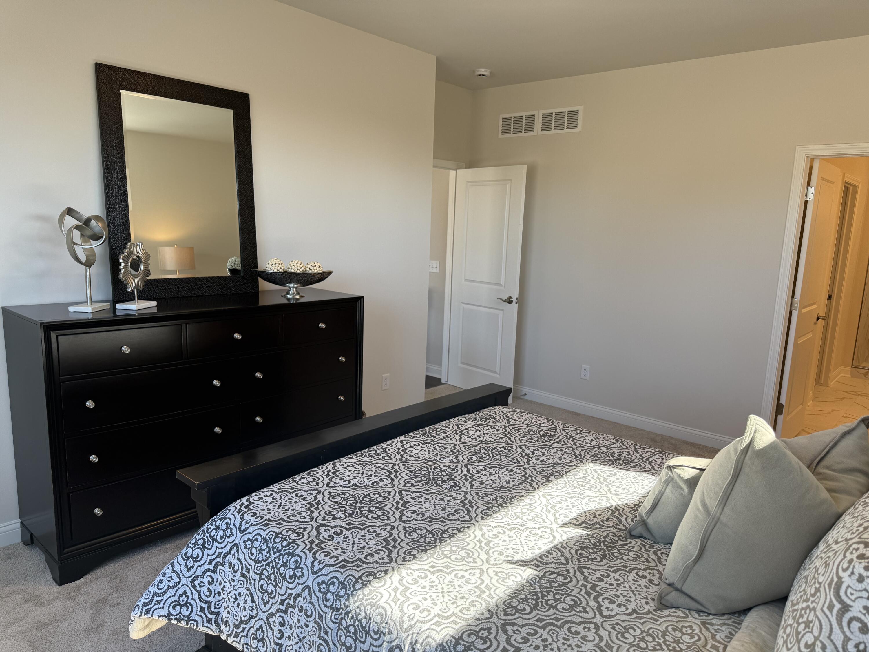 327 Sandy Circle Pewaukee, WI 53072 - Photo 10 of 22 Primary Bedroom - bright and airy