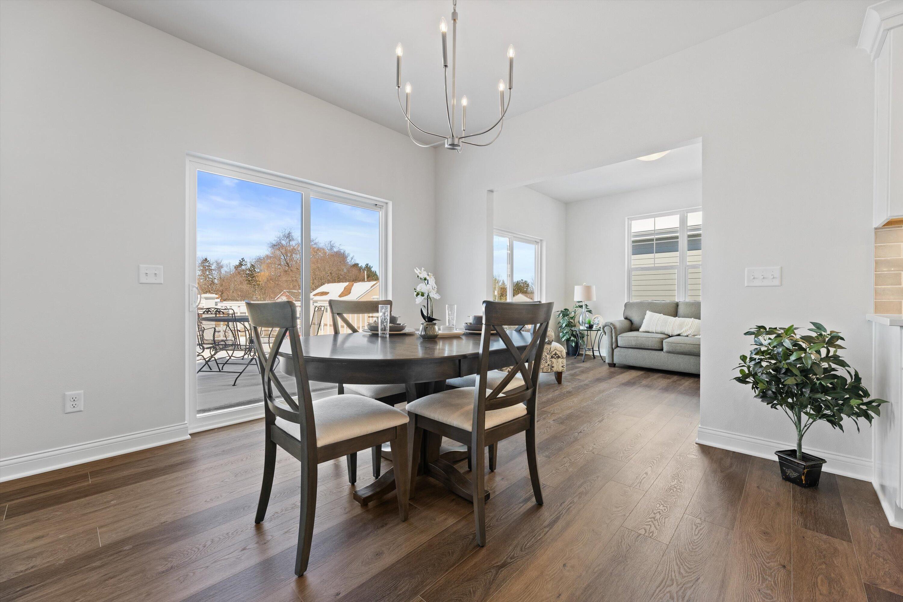327 Sandy Circle Pewaukee, WI 53072 - Photo 19 of 36 Dining Area leads to expansive deck