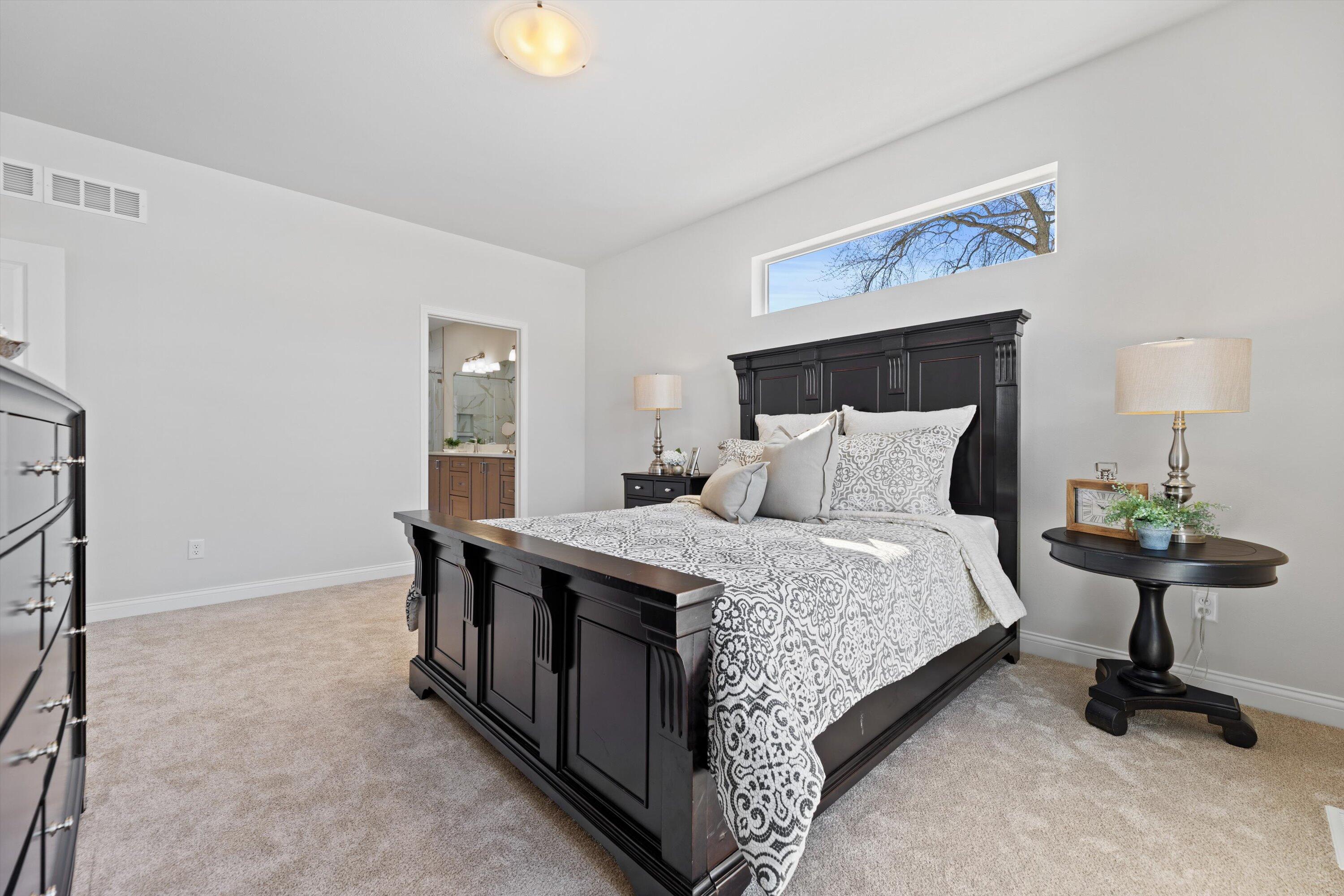 327 Sandy Circle Pewaukee, WI 53072 - Photo 24 of 36 Owner's Bedroom w Bathroom Entrance