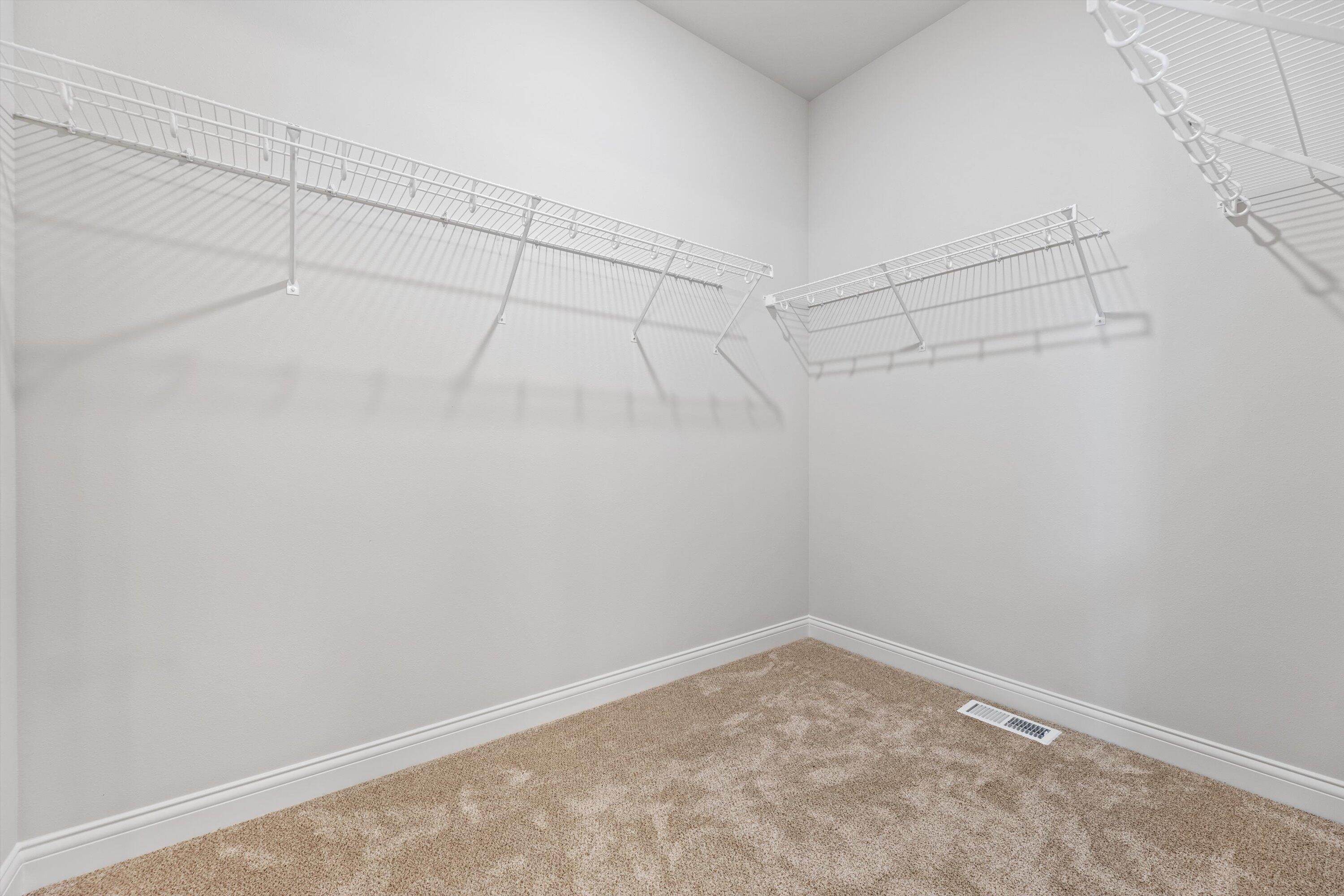 327 Sandy Circle Pewaukee, WI 53072 - Photo 27 of 36 Owner's Walk in Closet