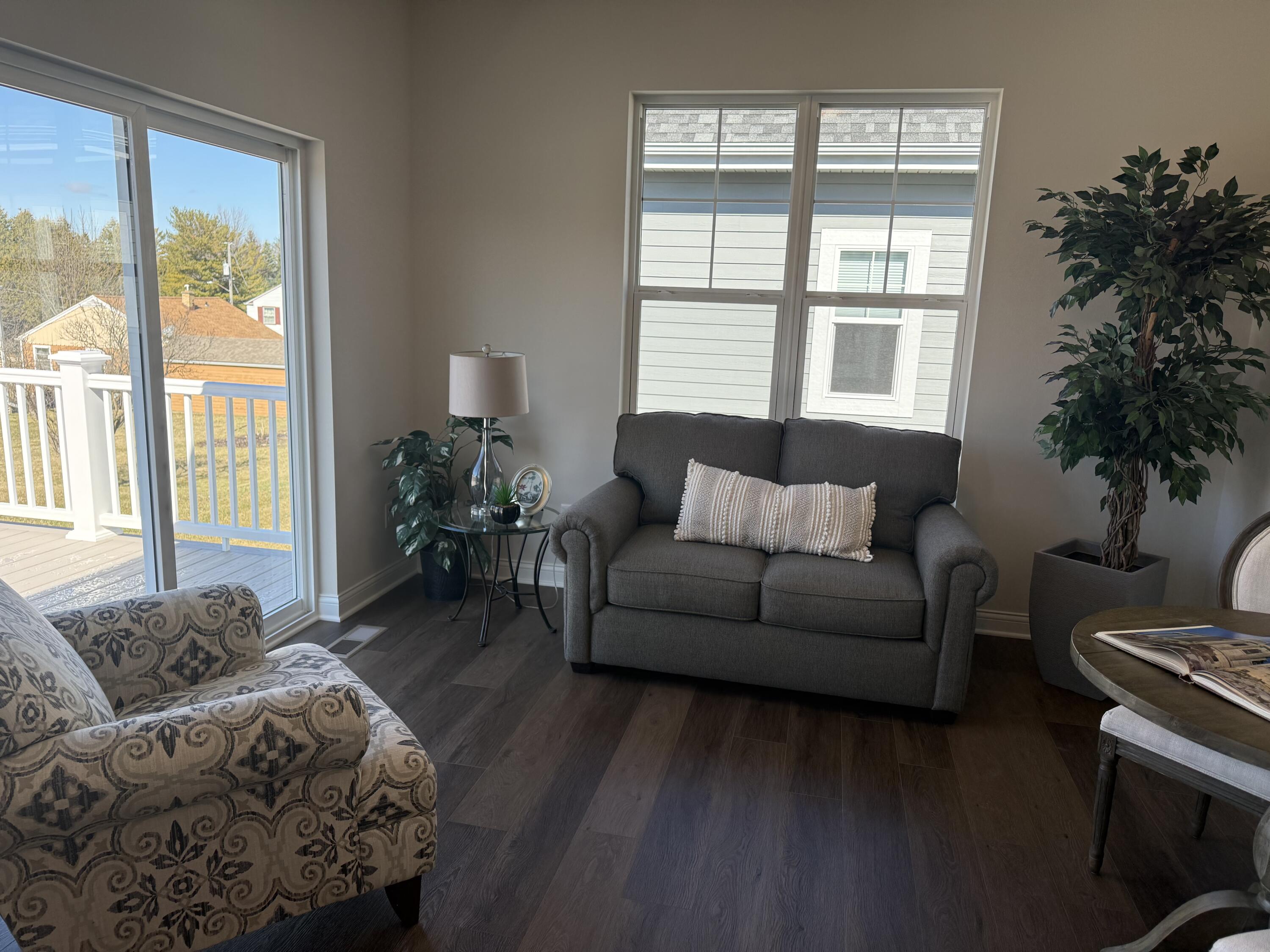 327 Sandy Circle Pewaukee, WI 53072 - Photo 7 of 22 Spacious Sunroom w/deck access