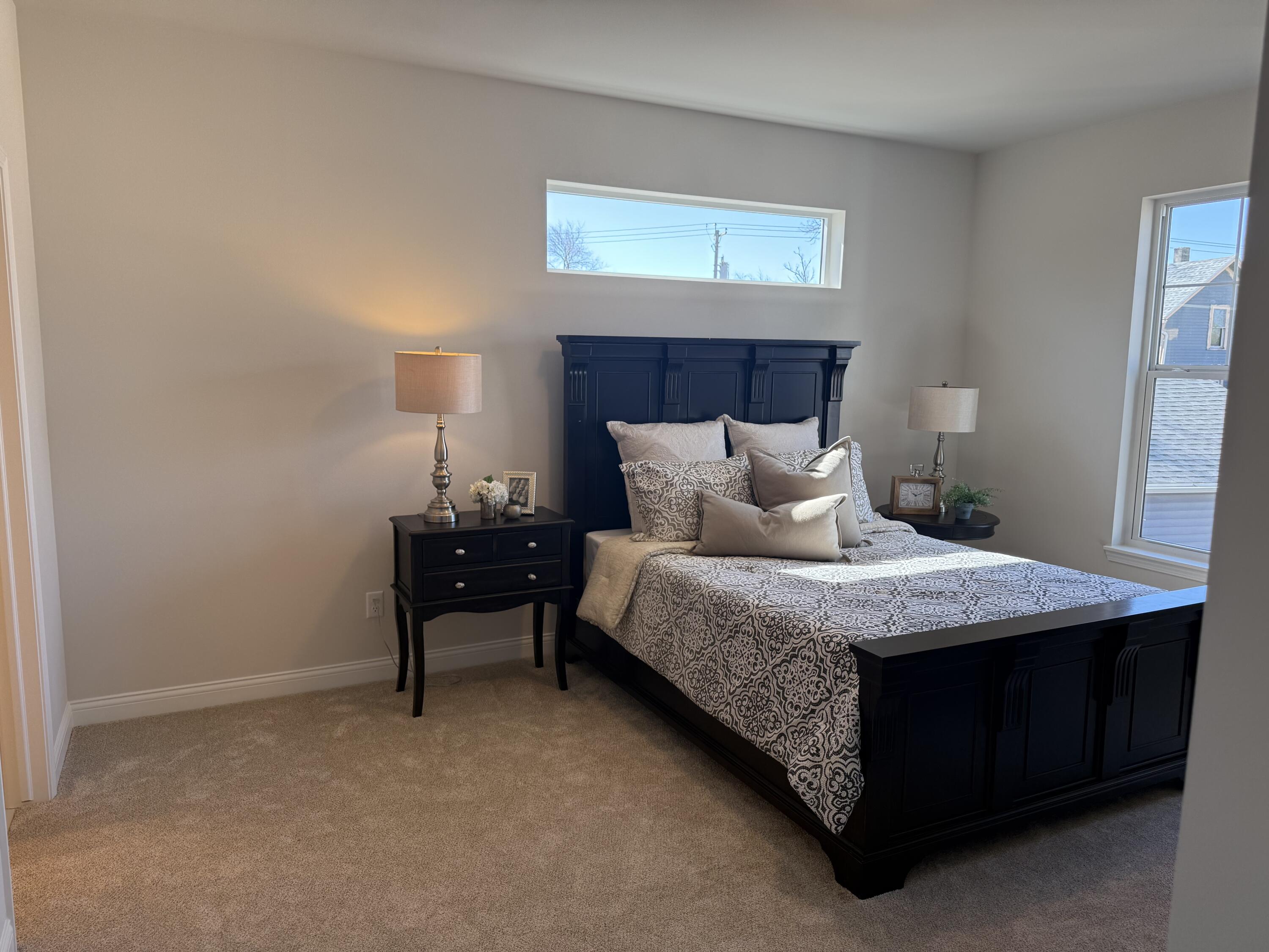 327 Sandy Circle Pewaukee, WI 53072 - Photo 9 of 22 Primary Bedroom w/natural light