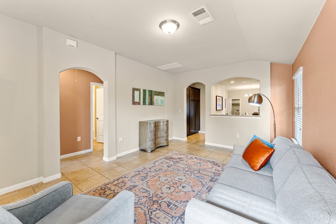408 Cane River Road Pflugerville, TX 78660 - Photo 11 of 38 a living room with furniture and a rug