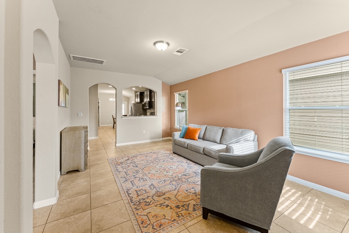 408 Cane River Road Pflugerville, TX 78660 - Photo 12 of 38 a living room with furniture and a window