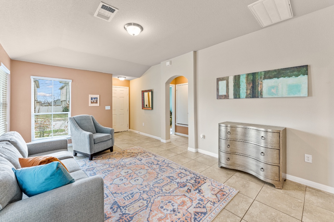 408 Cane River Road Pflugerville, TX 78660 - Photo 13 of 38 a living room with furniture and a window
