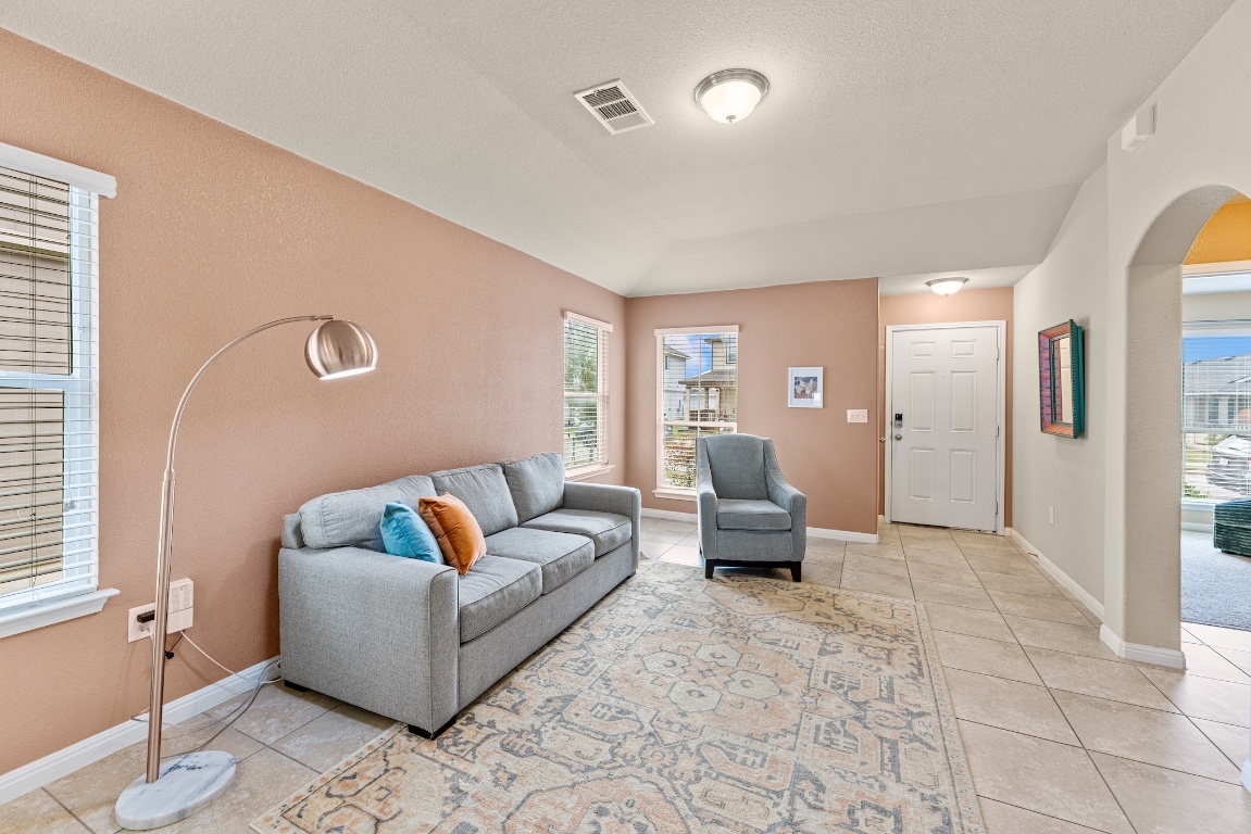 408 Cane River Road Pflugerville, TX 78660 - Photo 14 of 38 a living room with furniture and a couch