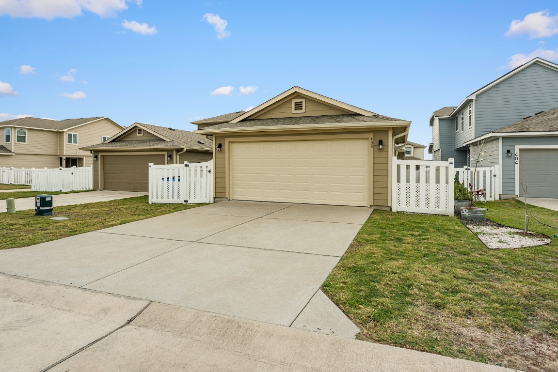 408 Cane River Road Pflugerville, TX 78660 - Photo 38 of 38 a front view of a house with garden