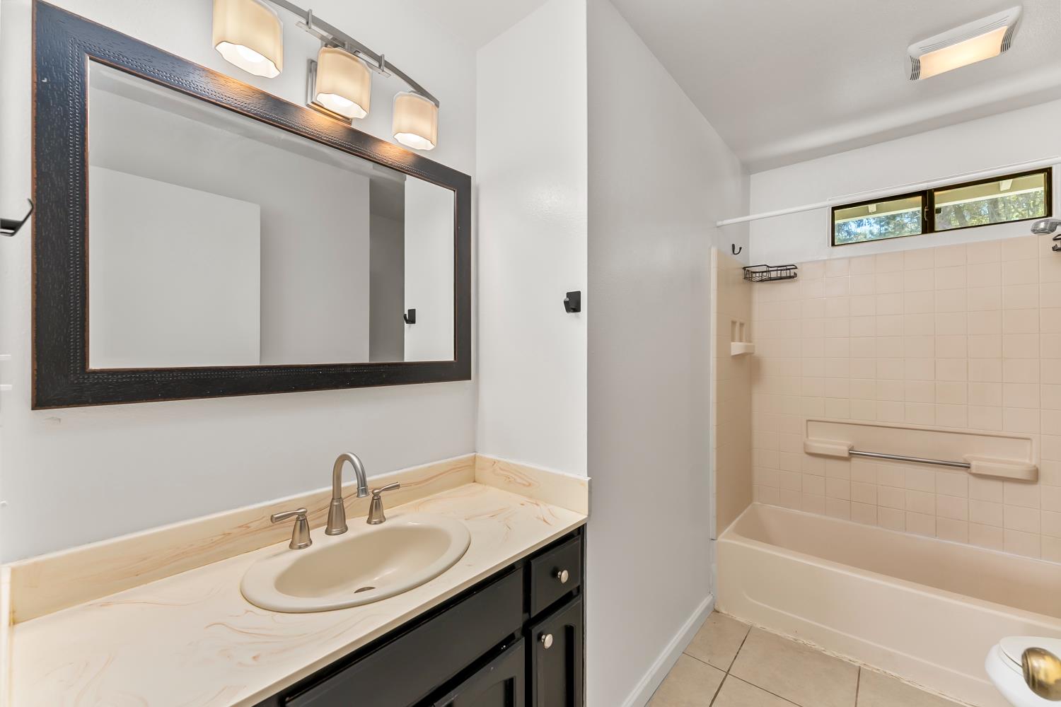 4705 Sand Ridge Road Placerville, CA 95667 - Photo 24 of 36 a bathroom with a granite countertop sink and a mirror