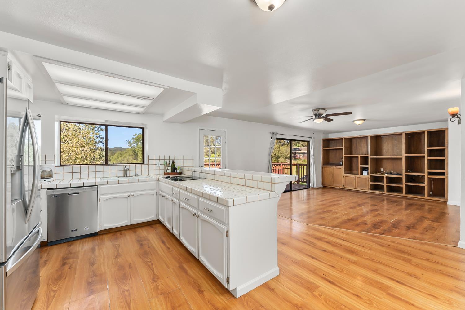4705 Sand Ridge Road Placerville, CA 95667 - Photo 3 of 36 a large kitchen with stainless steel appliances granite countertop a large center island and a stove top oven