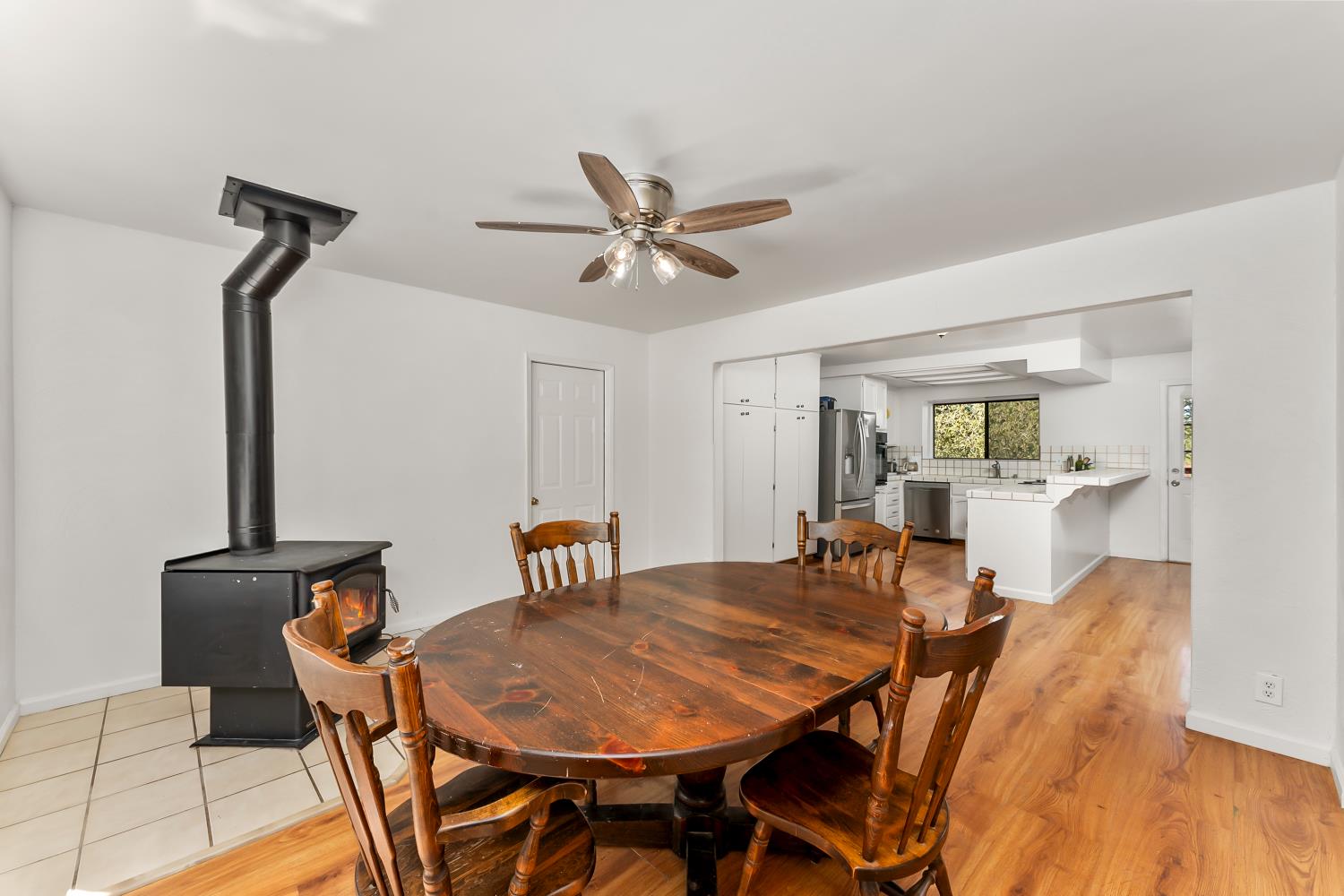 4705 Sand Ridge Road Placerville, CA 95667 - Photo 7 of 36 a view of a dining room with furniture and wooden floor