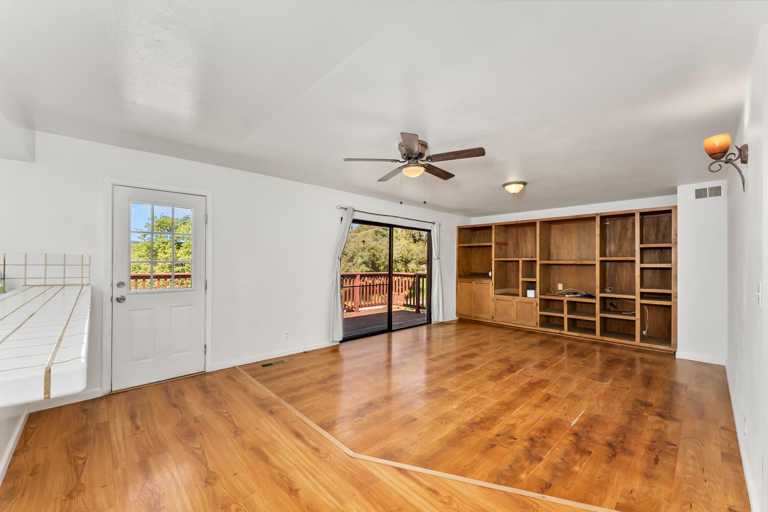 4705 Sand Ridge Road Placerville, CA 95667 - Photo 8 of 36 a view of an empty room with a window and wooden floor