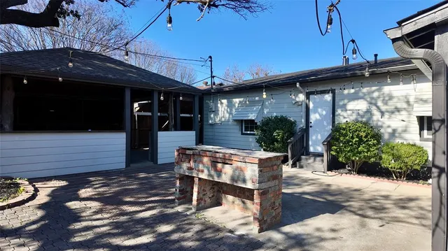 a view of a patio with table and chairs with wooden floor