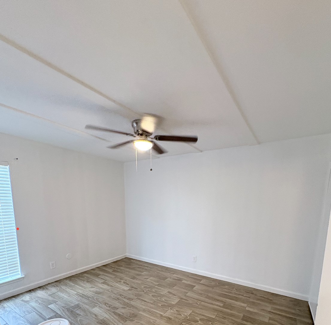 6200 West Tidwell Road West, Unit 1002 Houston, TX 77092 - Photo 7 of 8 wooden floor in an empty room