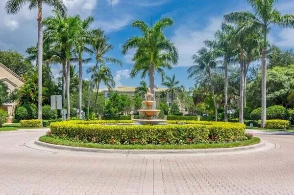 a view of a garden with a fountain