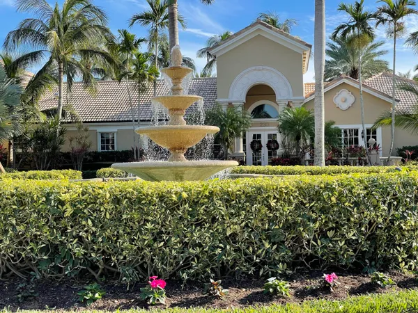 a view of a house with swimming pool and a yard