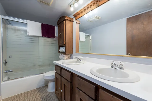 a view of an empty room and closet area