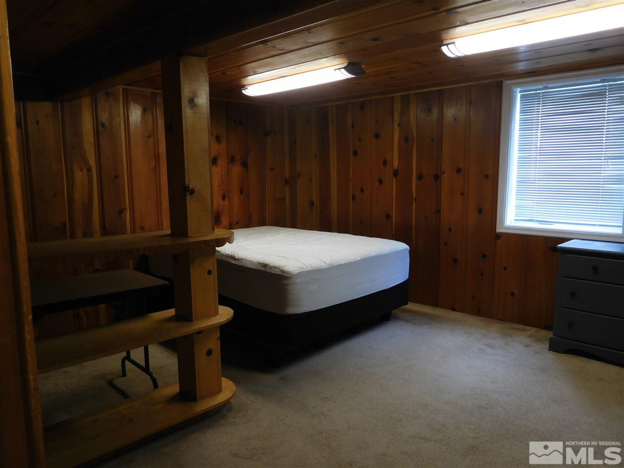 1160 The Strand Reno, NV 89503 - Photo 11 of 14 a bed sitting in a room next to a window