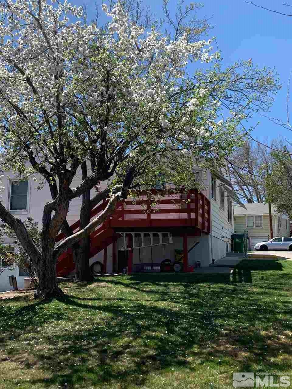 1160 The Strand Reno, NV 89503 - Photo 13 of 14 a front view of a house with a garden