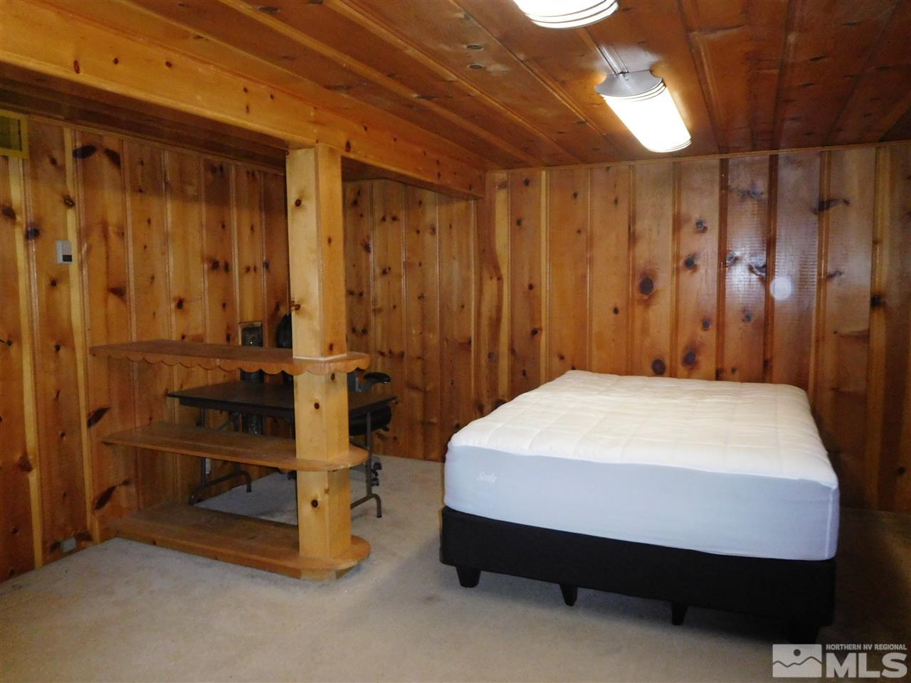1160 The Strand Reno, NV 89503 - Photo 8 of 14 a bedroom with a bed and a table