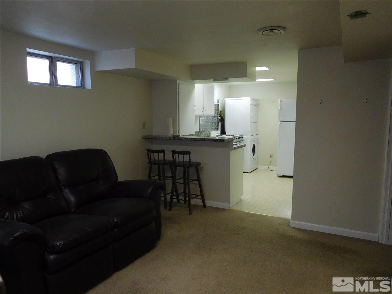 1160 The Strand Reno, NV 89503 - Photo 10 of 14 a living room with furniture and a dining table