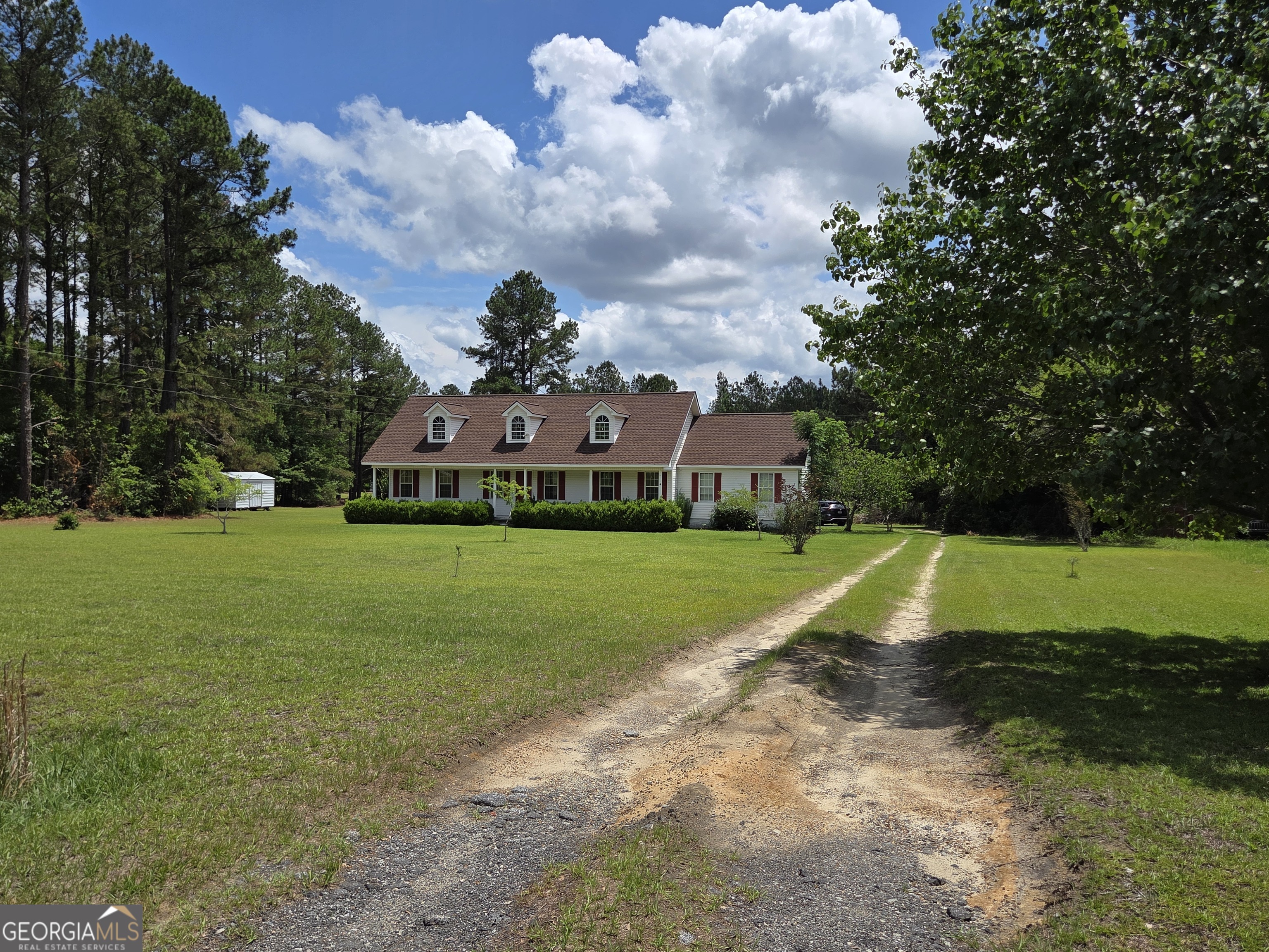 9546 Union Road Metter, GA 30439 - Photo 2 of 45 a view of yard with swimming pool and green space