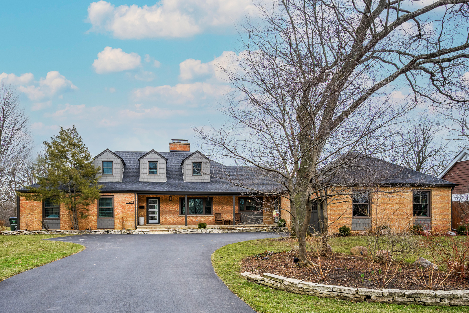 1627 Del Ogier Drive Glenview, IL 60025 - Photo 1 of 37 a front view of a house with a yard