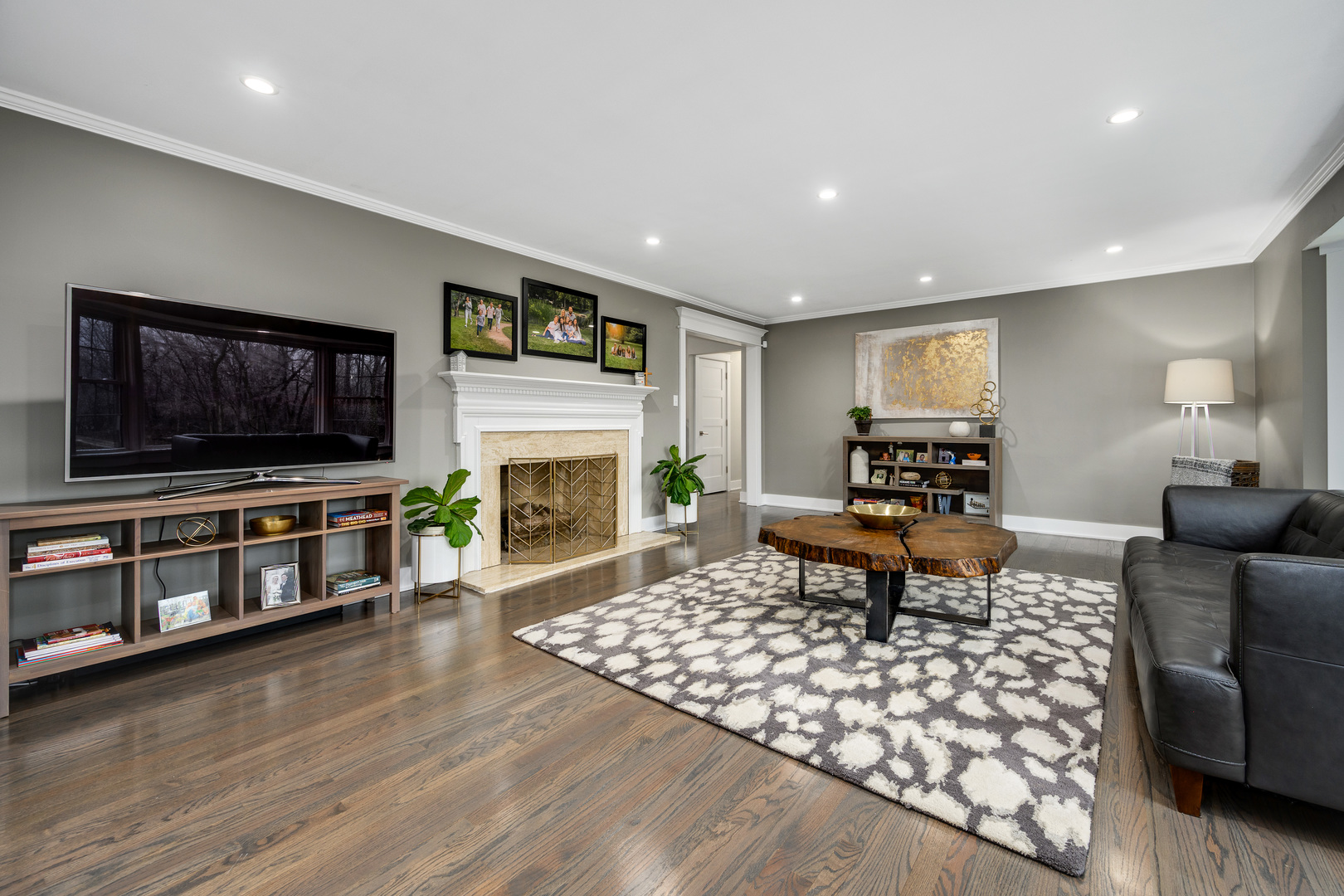 1627 Del Ogier Drive Glenview, IL 60025 - Photo 12 of 37 a living room with furniture a flat screen tv and a fireplace