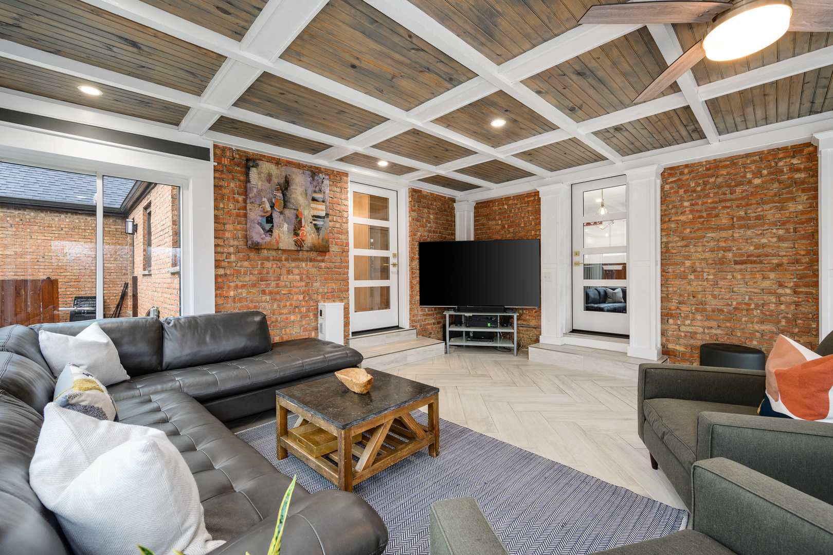 1627 Del Ogier Drive Glenview, IL 60025 - Photo 14 of 37 a living room with furniture a flat screen tv and a large window