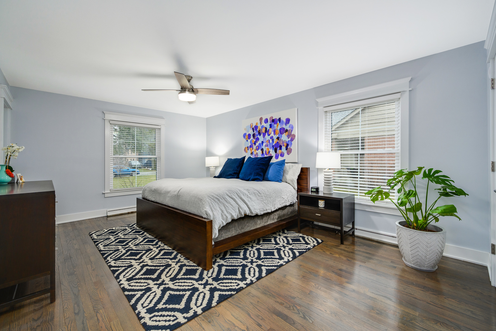 1627 Del Ogier Drive Glenview, IL 60025 - Photo 18 of 37 a bedroom with a bed and a potted plant