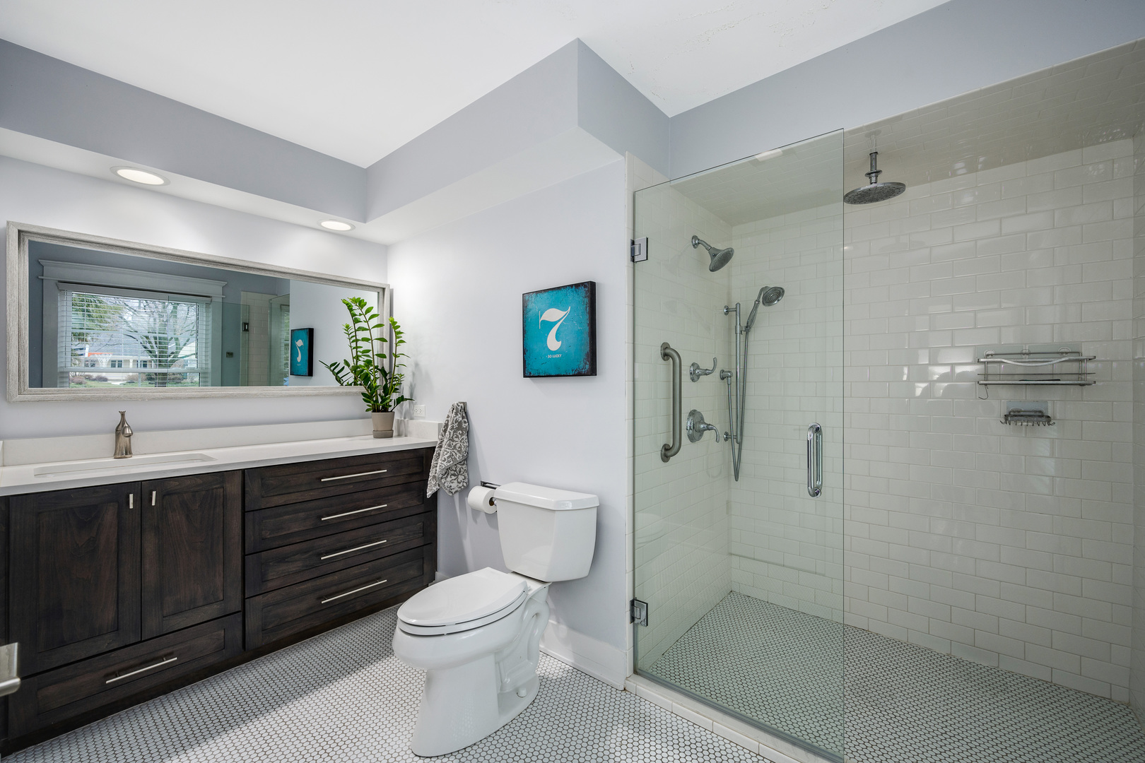 1627 Del Ogier Drive Glenview, IL 60025 - Photo 19 of 37 a bathroom with a sink a toilet and shower