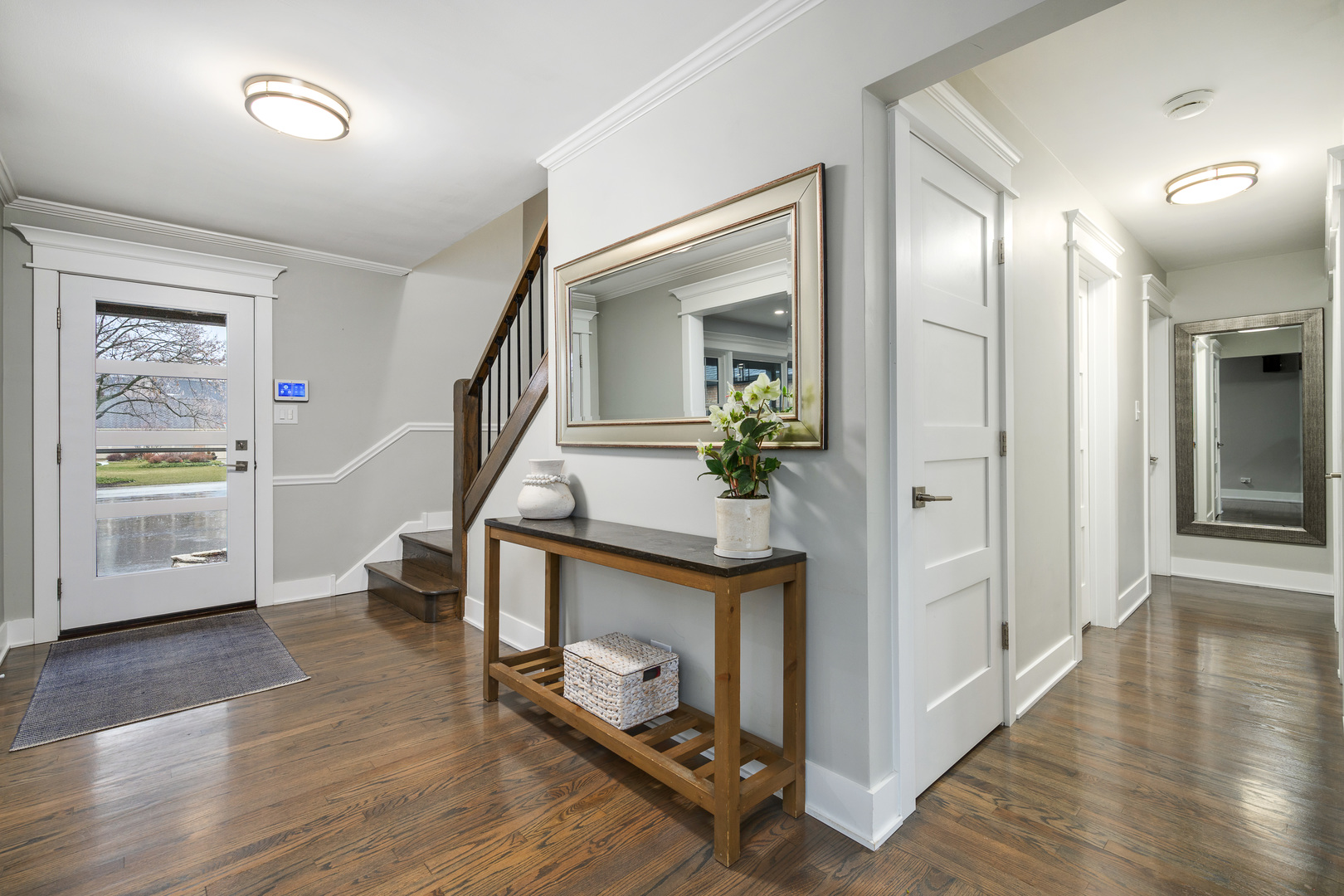 1627 Del Ogier Drive Glenview, IL 60025 - Photo 2 of 37 a view of an entryway with wooden floor and a livingroom view