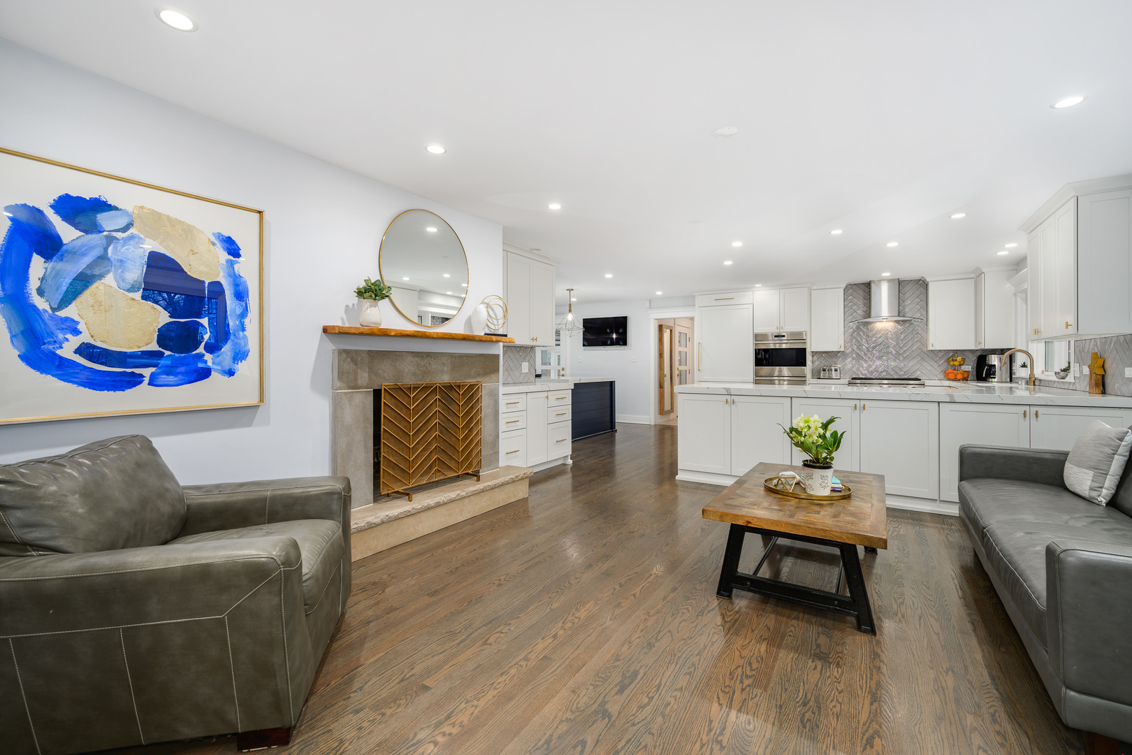 1627 Del Ogier Drive Glenview, IL 60025 - Photo 3 of 37 a living room with furniture a fireplace and kitchen view