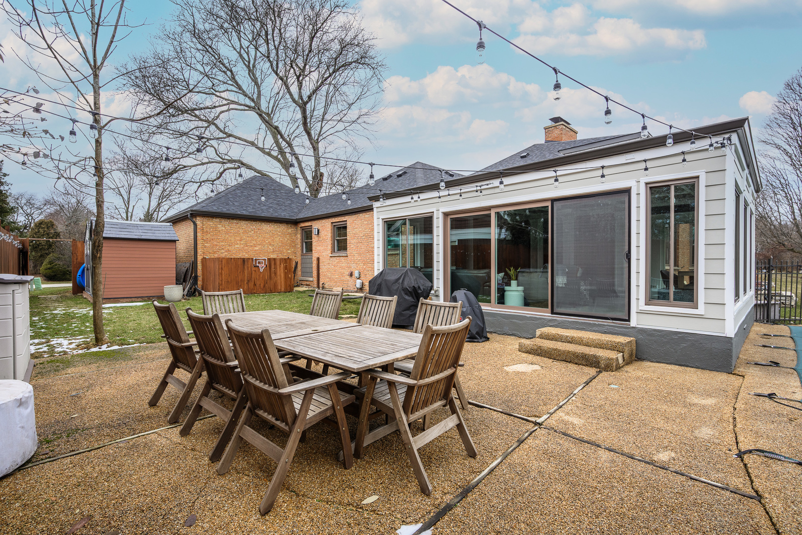 1627 Del Ogier Drive Glenview, IL 60025 - Photo 31 of 37 a view of a patio with a table and chairs and floor to ceiling window