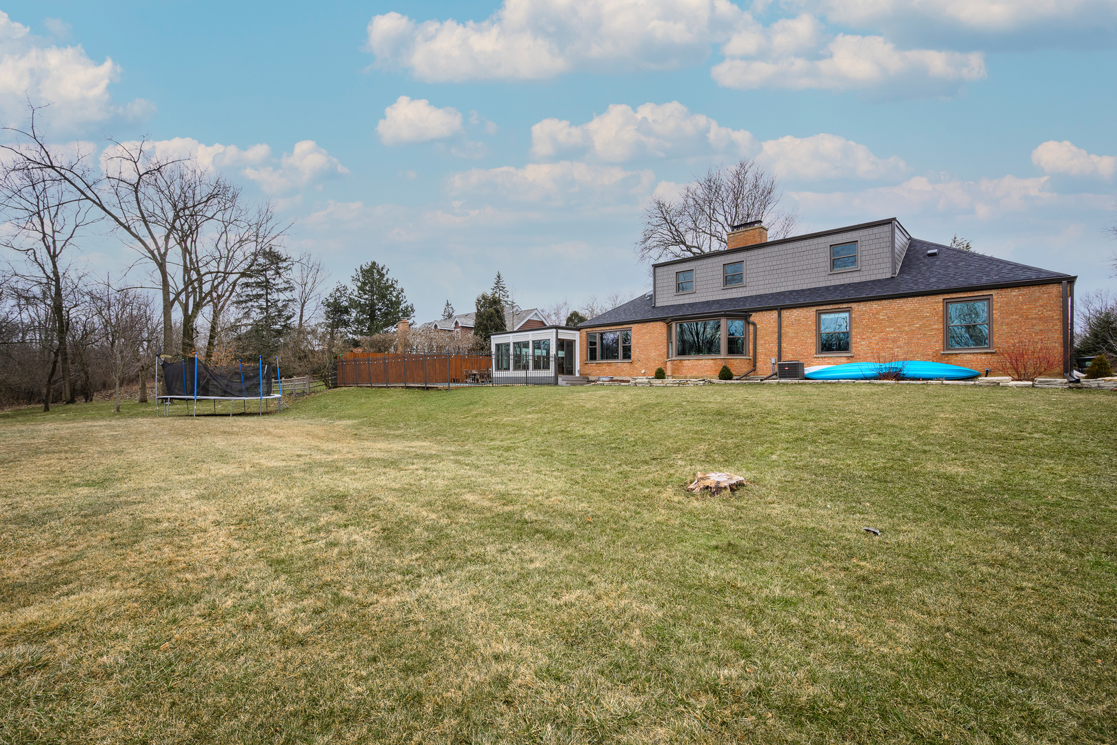 1627 Del Ogier Drive Glenview, IL 60025 - Photo 33 of 37 a view of a house with a big yard and large trees