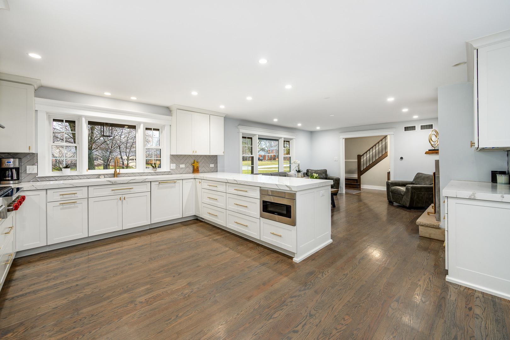 1627 Del Ogier Drive Glenview, IL 60025 - Photo 6 of 37 a kitchen with white cabinets and white appliances