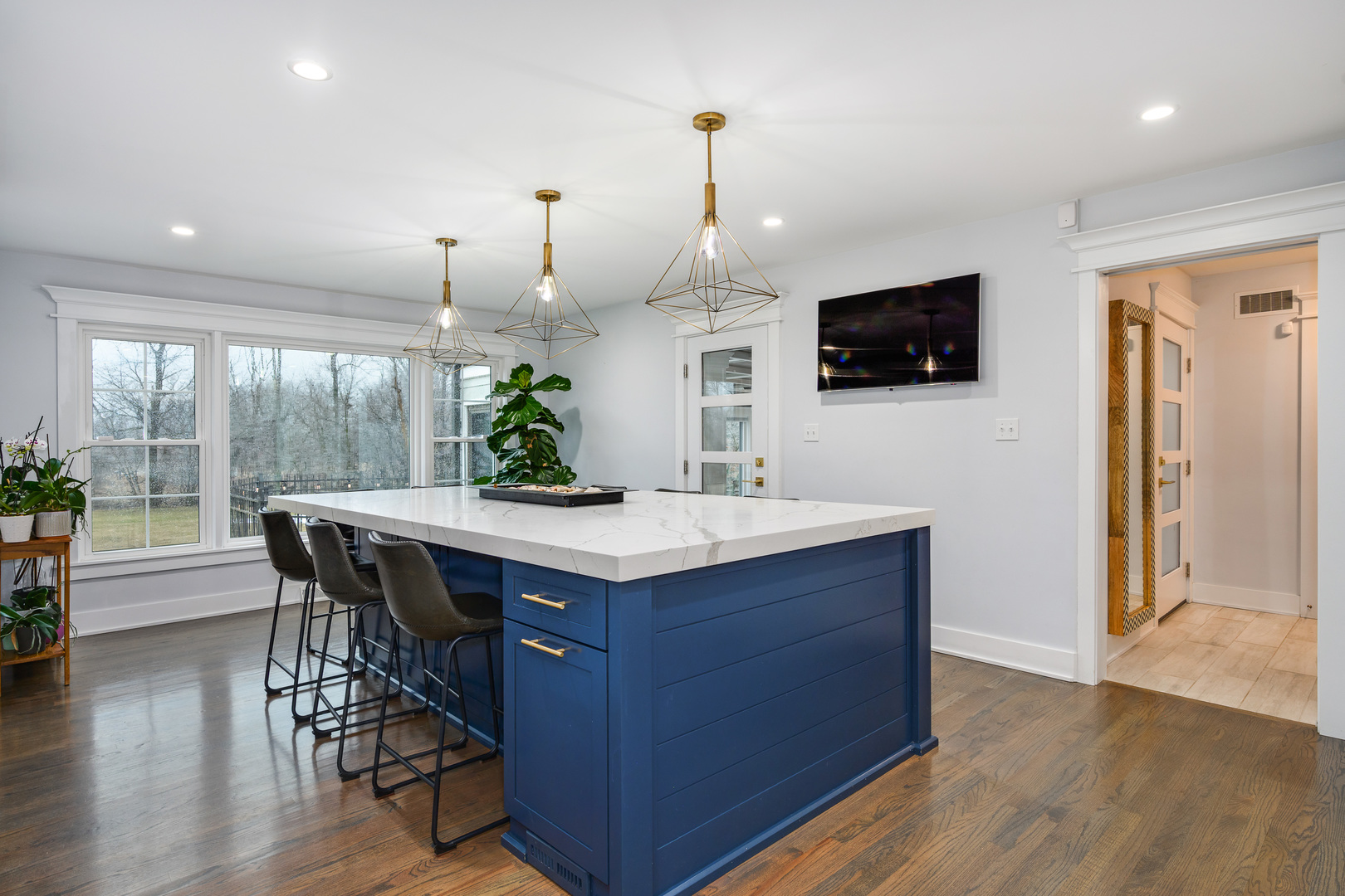 1627 Del Ogier Drive Glenview, IL 60025 - Photo 9 of 37 a kitchen with a table chairs refrigerator and microwave