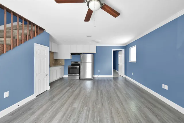 a view of kitchen and wooden floor
