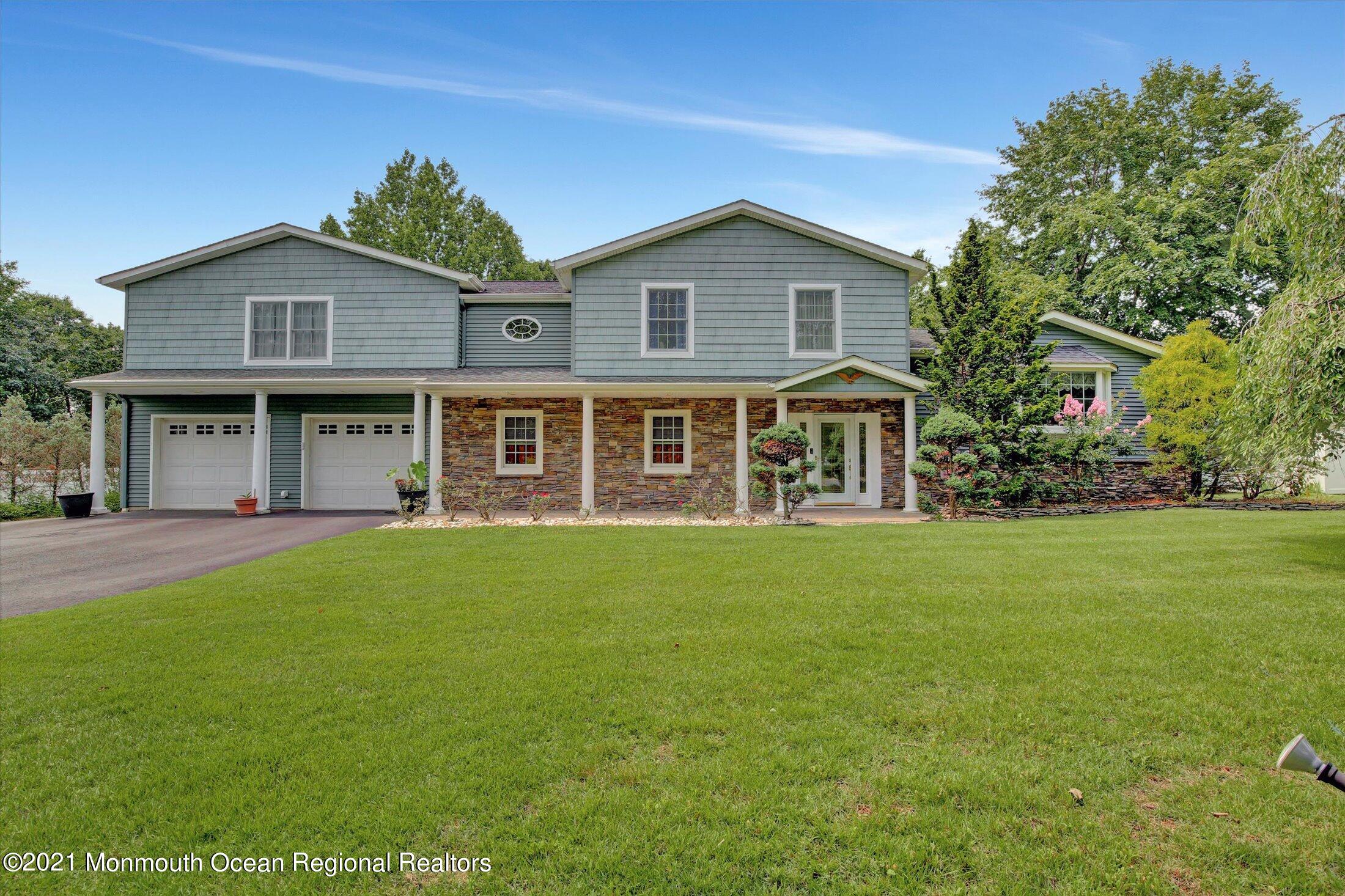 76 Swimming River Road Lincroft, NJ 07738 - Photo 1 of 50 a view of a house with a garden